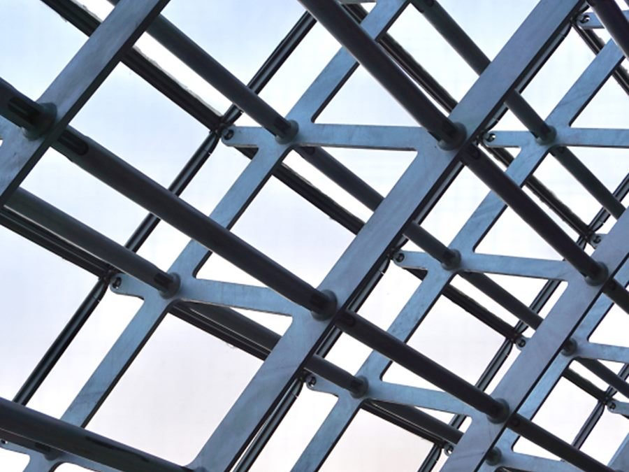 Galvanised structural steel roof framing seen from below