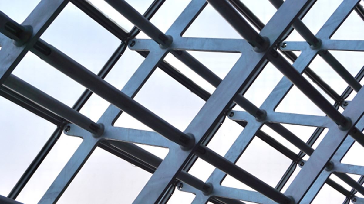Galvanised structural steel roof framing seen from below