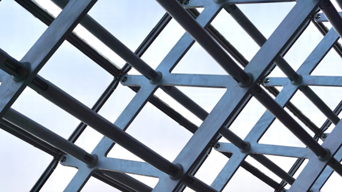 Galvanised structural steel roof framing seen from below